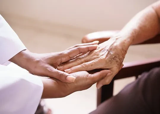 A close up image of holding hands