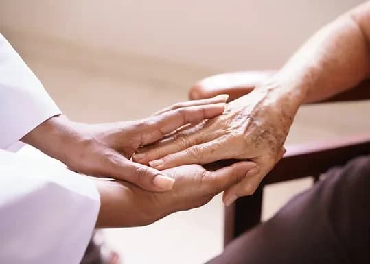 A close up image of holding hands